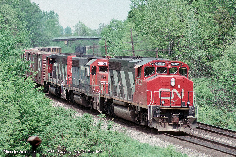 CN 9402, GTW 6421, and an unidentified GP40-2W lead train 333 through Bayview Junction