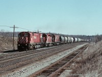 CP 4570, CP 5555(?) and CP 4558 lead a westbound through Guelph Junction on April 7th, 1990