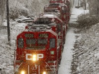 Dashing through the snow...  an eastbound CP Rail freight train crosses the bridge over the Otonabee River in central Peterborough this morning on its way to the Nephton mine north of Havelock.  