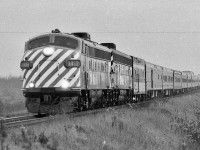 <br>
<br>
 VIA Rail's October 29, 1978 'takeover' * of the CP Rail ' The Canadian ' resulted in the immediate re-routing* of the   CP Rail trains #11 & #12  from the CP Rail Mactier Sub  to the CN Newmarket / Bala ** Subdivisions as VIA Rail The Canadian Toronto – Calgary - Vancouver trains #1 & #2, on a three night schedule. 
<br>
<br>
 The 'new ' VIA  Rail 'The Canadian' routing replaced the CN Super Continental *** on the Newmarket / Bala Subdivisions  
<br>
<br>
  A week into the new routing, the 'new' VIA Rail train #1 ' The Canadian' , with ex CP Rail GMD FP9 #1412,  is on the CN Newmarket Subdivision, seen here  somewhere north of King City, November 1978 Kodak negative by S.Danko
<br>
<br>
  *  annulling rail passenger service at the CP Rail stations: Mactier, Medonte ( Coldwater, Orillia), Midhurst (Barrie), Alliston, West Toronto
<br>
<br>
 **  'The Canadian' new route had train #1  transferring on to CP Rail at Reynolds, CP Parry Sound Subdivision at CN Boyne, CN Bala Sub), and vice versa for train #2
<br>
<br>
 what's interesting
<br>
<br>
 *** effective October 29 1978 the ex CN Super Continental became VIA Super Continental  Montreal – Edmonton - Vancouver trains #3 & #4, on a three night schedule – a dramatic improvement from the decades old CN four night schedule! 
<br>
<br>
 [ noteworthy: the Toronto connection for the Super C became Toronto – North Bay trains #121 & #122 ( ( all reserved, no checked baggage ) yes !  the Northlander !  ( the Super Northlander Connector ?! ) ]
<br>
<br>
  the new October 1978 routing for trains 1,2,3,4 did not last, by June 17, 1979 VIA flipped the arrangement and the Super C became the Toronto – Edmonton – Vancouver train and The Canadian the Montreal – Calgary – Vancouver train, ( perhaps to facilitate easier servicing for the ex CP equipment with ex CP personnel at the CP Montreal shops ?). 
<br>
<br>
 Really noteworthy is the June 1979 Super C  Toronto – Edmonton – Vancouver retained the three night schedule ! 
<br>
<br>
  unusual 1978 sightings becomes the usual:
<br>
<br>
 <a href="http://www.railpictures.ca/?attachment_id= 6870">  the final weeks & underpowered  </a>
<br>
<br>
 <a href="http://www.railpictures.ca/?attachment_id= 7292">  colourful  </a>
<br>
<br>
 <a href="http://www.railpictures.ca/?attachment_id= 8558">  bemused observers  </a>
<br>
<br>
<a href="http://www.railpictures.ca/?attachment_id=  8056">  VIA variety & variety plus  </a>
<br>
<br>
 sdfourty
