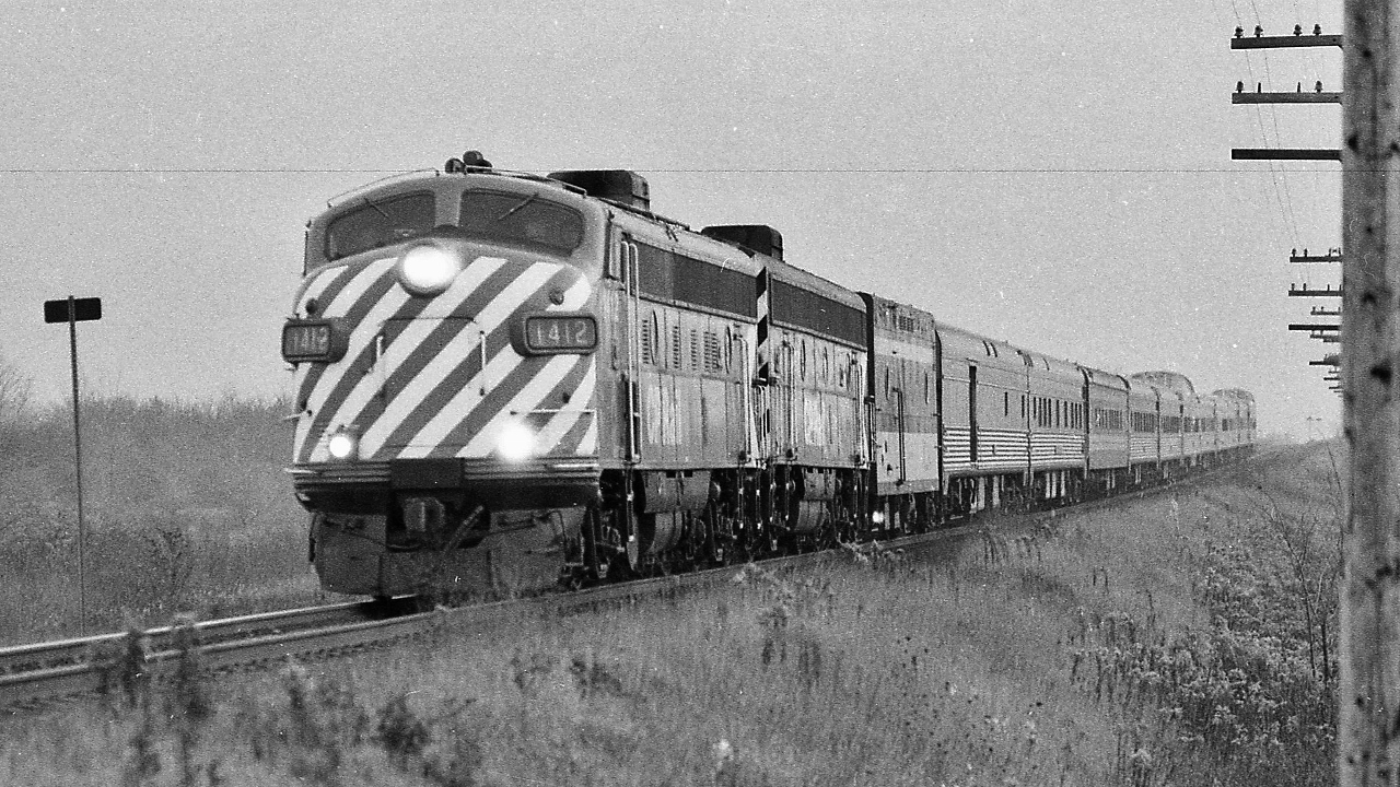 VIA Rail's October 29, 1978 'takeover' * of the CP Rail ' The Canadian ' resulted in the immediate re-routing* of the   CP Rail trains #11 & #12  from the CP Rail Mactier Sub  to the CN Newmarket / Bala ** Subdivisions as VIA Rail The Canadian Toronto – Calgary - Vancouver trains #1 & #2, on a three night schedule. 


 The 'new ' VIA  Rail 'The Canadian' routing replaced the CN Super Continental *** on the Newmarket / Bala Subdivisions  


  A week into the new routing, the 'new' VIA Rail train #1 ' The Canadian' , with ex CP Rail GMD FP9 #1412,  is on the CN Newmarket Subdivision, seen here  somewhere north of King City, November 1978 Kodak negative by S.Danko


  *  annulling rail passenger service at the CP Rail stations: Mactier, Medonte ( Coldwater, Orillia), Midhurst (Barrie), Alliston, West Toronto


 **  'The Canadian' new route had train #1  transferring on to CP Rail at Reynolds, CP Parry Sound Subdivision at CN Boyne, CN Bala Sub), and vice versa for train #2


 what's interesting


 *** effective October 29 1978 the ex CN Super Continental became VIA Super Continental  Montreal – Edmonton - Vancouver trains #3 & #4, on a three night schedule – a dramatic improvement from the decades old CN four night schedule! 


 [ noteworthy: the Toronto connection for the Super C became Toronto – North Bay trains #121 & #122 ( ( all reserved, no checked baggage ) yes !  the Northlander !  ( the Super Northlander Connector ?! ) ]


  the new October 1978 routing for trains 1,2,3,4 did not last, by June 17, 1979 VIA flipped the arrangement and the Super C became the Toronto – Edmonton – Vancouver train and The Canadian the Montreal – Calgary – Vancouver train, ( perhaps to facilitate easier servicing for the ex CP equipment with ex CP personnel at the CP Montreal shops ?). 


 Really noteworthy is the June 1979 Super C  Toronto – Edmonton – Vancouver retained the three night schedule ! 


  unusual 1978 sightings becomes the usual:


   the final weeks & underpowered  


   colourful  


   bemused observers  


  VIA variety & variety plus  


 sdfourty