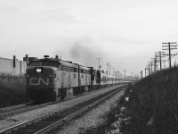 <br>
<br>
 The dreary drab dull and gritty days of November...circa 1979 
<br>
<br>
 interesting times, and with VIA repainting CN ( and CP Rail ) units as fast as possible …
<br>
<br>
 ….the push was on to capture the remaining CN noodle passenger units
<br>
<br>
  VIA 68 on the Scarborough Hill with ex CN FPA-4's and a GEEP: 6793 – 67xx - 41xx
<br>
<br>
 near mile 326 Kingston Subdivision, November 1979 Kodak negative transported in a Nikkormat EL, by S.Danko
<br>
<br>
 what's interesting: 
<br>
<br>
 that 13 car conventional was considered normal for a Sunday afternoon 
<br>
<br>
 and that sound:  two FPA-4's at full throttle ! ( plus that geep too ) on jointed rail...
<br>
<br>
 do note: that jointed rail  has a  90  m.p.h.  limit !
<br>
<br>
 <a href="http://www.railpictures.ca/?attachment_id=  6555">  faster    </a>
<br>
<br>
 That view  is  looking west towards GECO, so:
<br>
<br>
 <a href="http://www.railpictures.ca/?attachment_id=  39856">  on the GECO    </a>
<br>
<br>
 sdfourty
