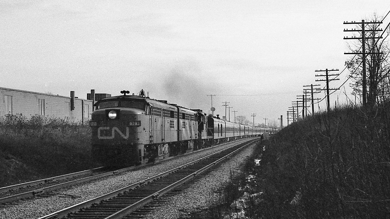 The dreary drab dull and gritty days of November...circa 1979 


 interesting times, and with VIA repainting CN ( and CP Rail ) units as fast as possible …


 ….the push was on to capture the remaining CN noodle passenger units


  VIA 68 on the Scarborough Hill with ex CN FPA-4's and a GEEP: 6793 – 67xx - 41xx


 near mile 326 Kingston Subdivision, November 1979 Kodak negative transported in a Nikkormat EL, by S.Danko


 what's interesting: 


 that 13 car conventional was considered normal for a Sunday afternoon 


 and that sound:  two FPA-4's at full throttle ! ( plus that geep too ) on jointed rail...


 do note: that jointed rail  has a  90  m.p.h.  limit !


   faster    


 That view  is  looking west towards GECO, so:


   on the GECO    


 sdfourty