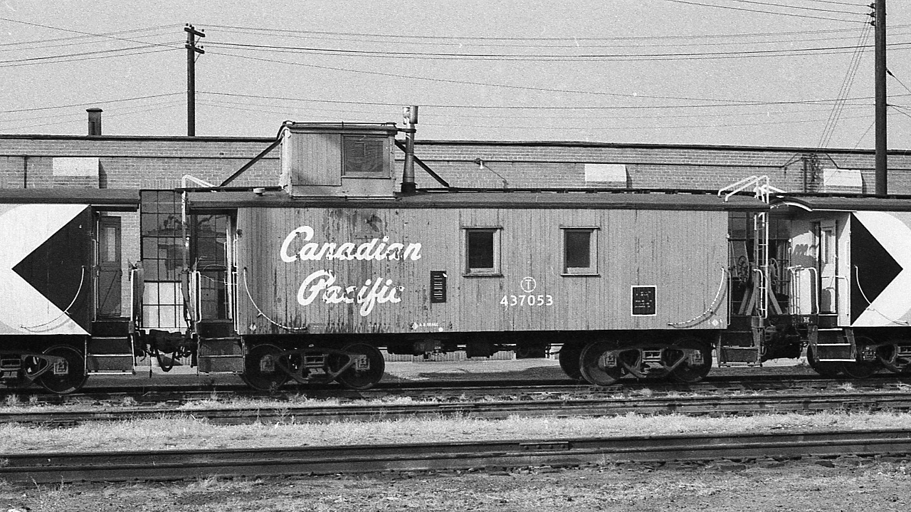 wooden caboose CP 437053 at John Street coupled between two modern ( for that time ) multimark CP Rail run through cabooses


 CP 437053 would survive into 1987, listed in the November issue Branchline along with 41 other wooden cabooses as sold, dismantled or slated for retirement ( and 10 run through steel cabooses with same fate)


 and at that time never occurred to me that the CP Rail multimark would be one day be history too
 

 At CP Rail John Street, 1977 Kodak negative by S.Danko