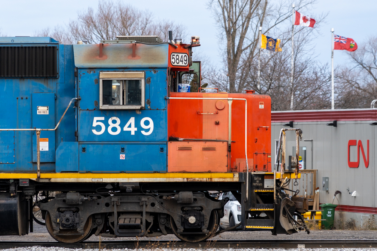 So many signs, logos and symbols, all seen in such a small space. Some safety related, some patriotic, some brand related, and some more relevant in the current age than ever before. DANGER 600 VOLTS, CN, Hamilton, Ontario, Canada, JUST SAY NO TO CRO, CAUTION NO FOOTBOARD, 5849, WARNING REMOTE CONTROL LOCOMOTIVE, automatic door, STOP.