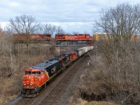 Sometimes the planets really do align. 254 went down the hill into the CTC, 247 got an "after" clearance, then 435 was done with its work at Aldershot and was told to "blast off." With as much train and as little power, the crew remarked that there would be no blasting. 2446 and 2124 were labouring to get the train going, the 4705 was just along for the ride. Amidst the leaf free winter forest, we saw headlights. Then we saw headlights again. "Wait," we said, "are those two sets of headlights? There's no way this is happening." And then it happened. CP 8743 and 8034, labouring themselves to get CP 247 moving after having waited for 254 to clear Desjardins, passed over 435 which was absolutely struggling to keep moving. Neither train would have been doing more than 15 miles an hour, and this was definitely to our benefit. An excellent turn of events to cap off 2020. All the best for 2021!