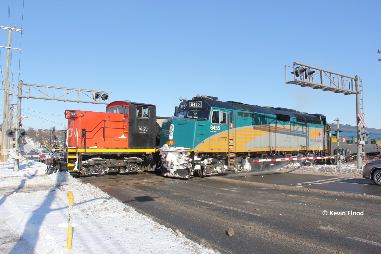 VIA 85 scoots past CN 568 performing switching at Kitchener Yard with GMD1 1439 on the point. They are pictured meeting at Lancaster St. in the midst of a polar vortex. This was a busy lunch hour for me.