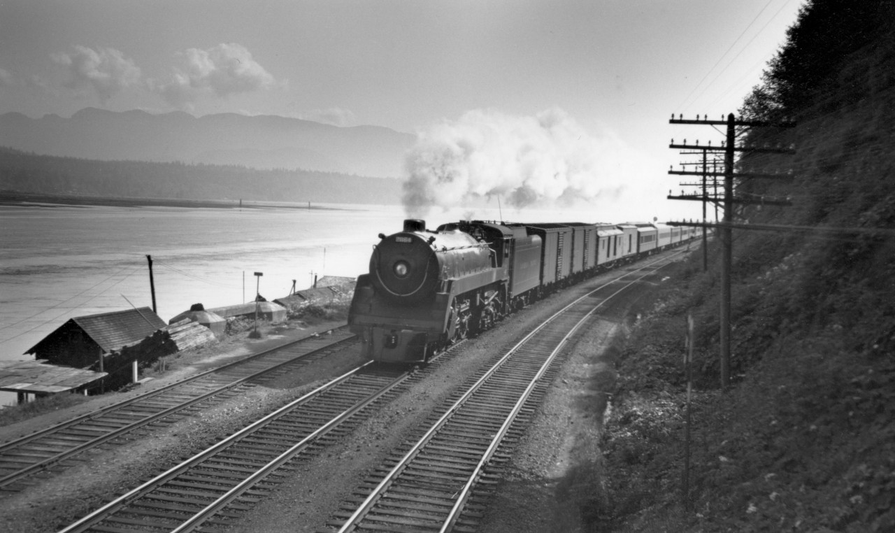 Train no. 7 with engine 2864 along Burrard inlet, 5 miles east of Vancouver