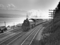 Train no. 7 with engine 2864 along Burrard inlet, 5 miles east of Vancouver