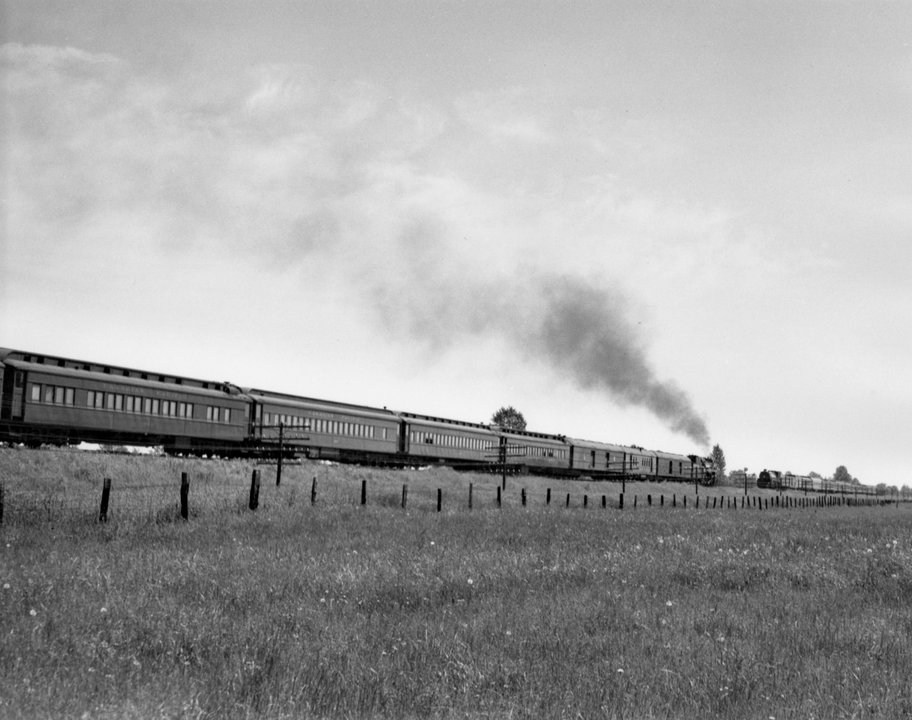 Train no. 2 with engine 2700 passing train no. 7 with engine 2863.  East of Pitt River.
