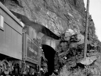 Second section of train no. 2 with engine 2707 at Harrison tunnels.  Engineer is waving at my uncle you can see crouched on the rocks near the tunnel.

In 1946 to 1949, my uncle Joe and my father Andy went railfanning together.  They called it "chasing trains".  My dad took the still pictures you see here and my uncle took movies with the family Bell and Howell 16mm movie camera.  It is a wind up camera and takes 16 frames/second.  You can find the videos by googling "youtube smokeywoodstover joe morin".  My uncle did not film any engines sitting around the shops, he only did action shots of trains passing and from the moving trains.