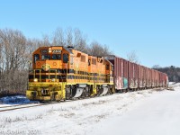 With empty newsprint boxcars in tow the QG heads west through St-Hermas.