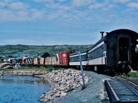 <br>
<br>
		                ....      The Rock   ......
<br>
<br>
				....     Very   Unique    ..... 
<br>
<br>
 ... on a warm sunny breezy beautiful Newfoundland summer day … the mixed trains were well patronized....
<br>
<br>
 Upon arrival at Carbonear, Terra Transport train #231( Tuesday, Thursday, Saturday ) spotted a CN box car and lifted a CP Rail box car plus two lumber loads, 
<br>
<br>
After a crew lunch break, TT train #232,  Carbonear to St.John's  ( Tuesday, Thursday, Saturday), is shown departing Carbonear 14:00 (scheduled 13:20)     
<br>
<br>
 Today's GMD 1956 built power: G-8's  805 – 800, the former now resides at the CRM, Saint-Constant P.Q.
<br>
<br>
  at Carbonear, Newfoundland  -  The  Rock  -    August 7, 1982 Kodachrome by S.Danko.
<br>
<br>
 More Carbonear:
<br>
<br>
<a href="http://www.railpictures.ca/?attachment_id= 7582">   Terra Transport #232   </a>
 <br>
<br>
 sdfourty
