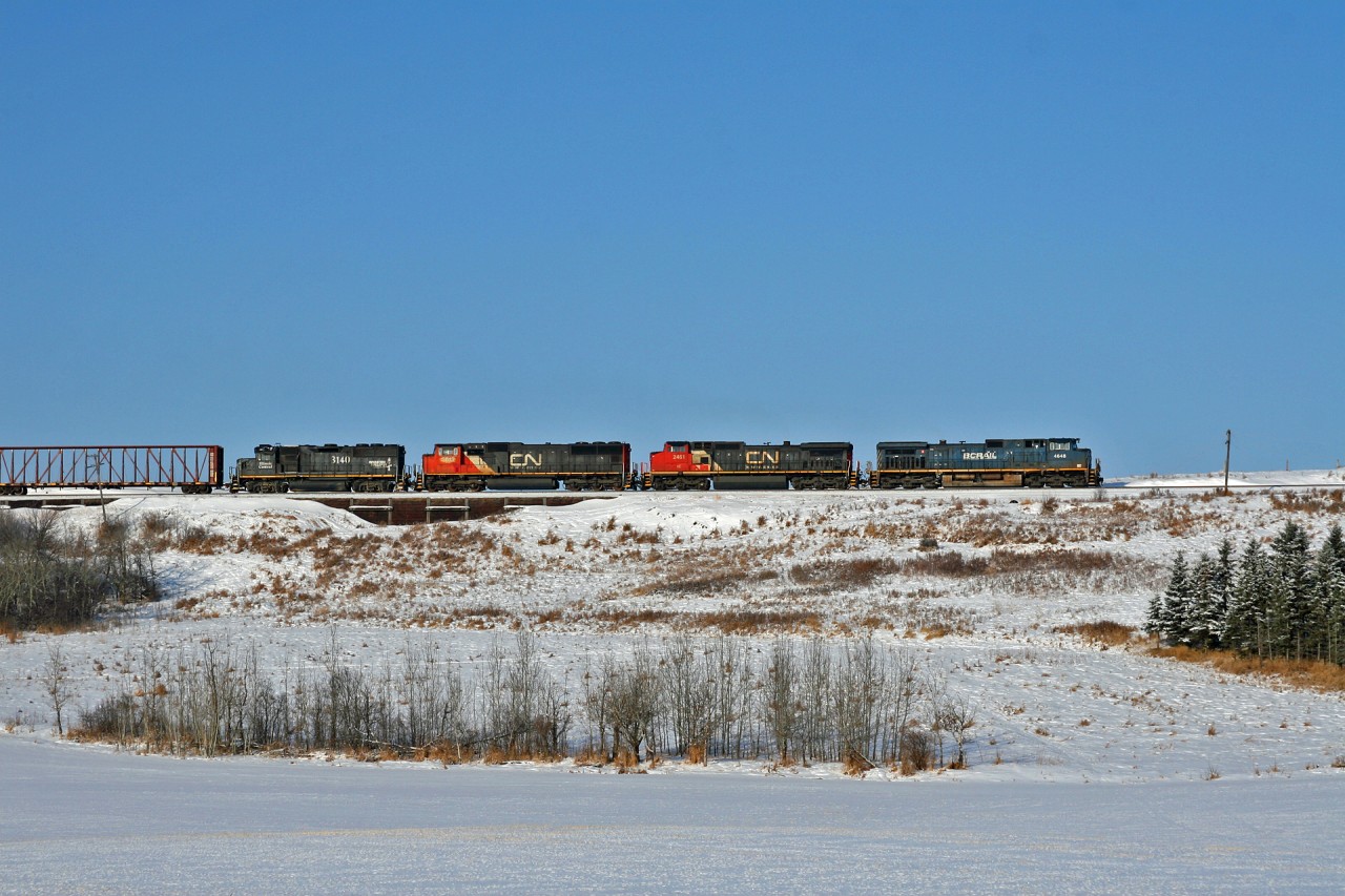 Big power on the former Northern Alberta Railway used to mean SD38-2's, however in 2021 this could mean any assortment of power on the CN roster.  Here we see 419 climbing out of the Sturgeon River Valley on its daily run from Edmonton to McLennan. BCOL 4648, IC 2461, CN 5613 and IC 3140 are in charge of this 118 car, 8170ft train.  Of note, operating 25 minutes behind BCOL 4648 north, was G 84951 29 with BCOL 4646 and CN 5620.