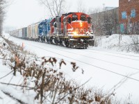 I’d usually be out on Boxing Day looking for deals on stuff but for obvious reasons I can’t do that. The roads are decently dead and really the only thing out there making noise on this end of town is 568’s engines as they do their switching duties on the east end of the yard building a train for Guelph. Hearing on the scanner that they’re looking for the light to head east with the 4028 once their work is done, I left home after hearing that as I knew the snow would kick things up photogenically with this veteran unit. I got here when they were just reversing back onto a cut of cars left by the previous L533 and as they started to pull for headroom, I pulled off this image which I’m pleased about as the snow just started calmly coming down as they passed the graffitied wall on the right drilling the east end of Kitchener Yard. 