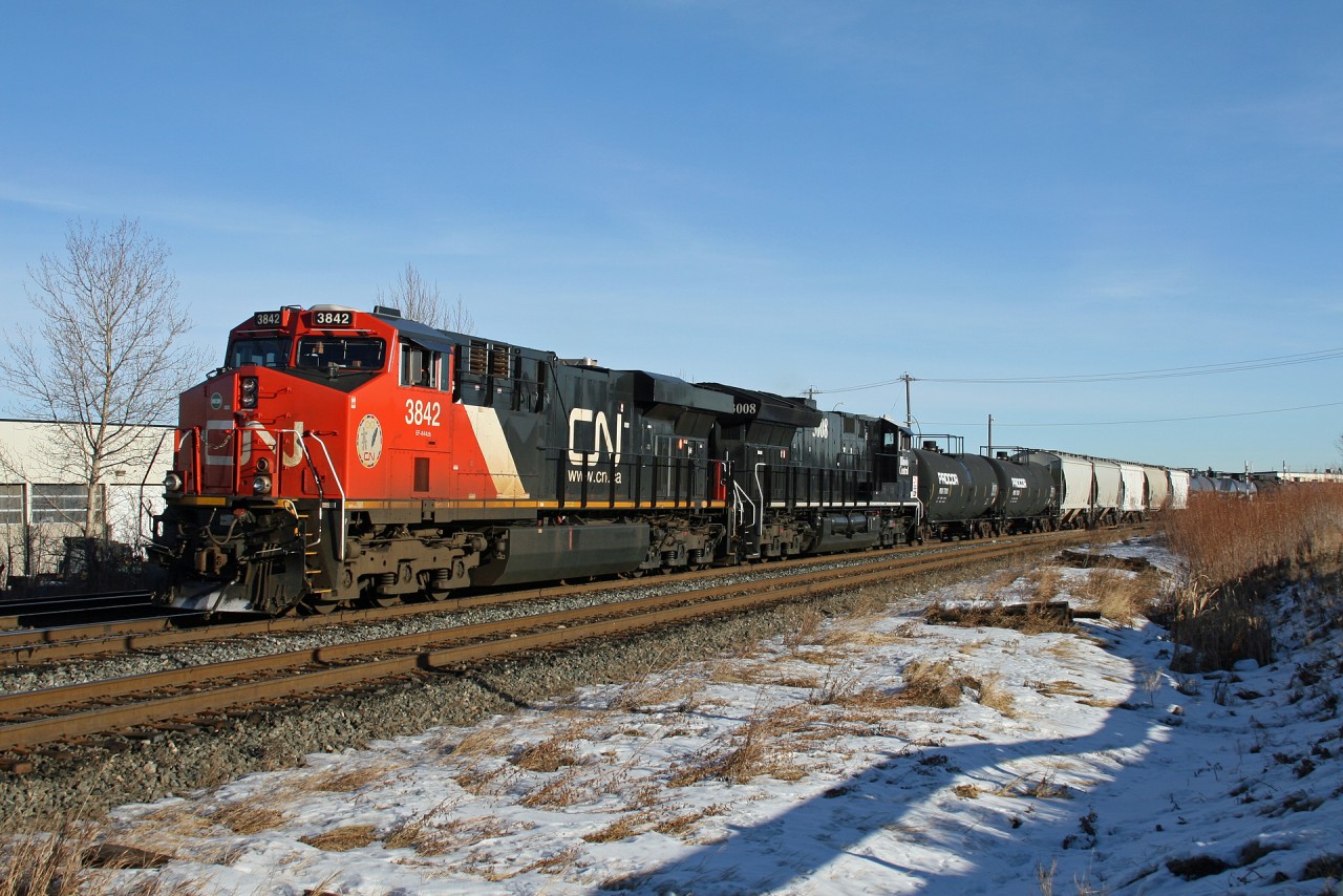 L 51951 04 crosses 149th Street with CN 3842 and CN 3008, sporting the IC Heritage scheme.  519 typically operates with a single SD40-2W, however today two big AC units were assigned to bring 25 cars to Acheson.