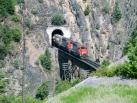 The 5166 and 5143 have just come out of a hole in the wall onto a short bridge. There is only 5.5 miles left to Boston Bar and the crew will enjoy a break waiting for their return ride to Kamloops. The mile board at the tunnel exit reads 120. Pretty certain of the year, month could be June or July.