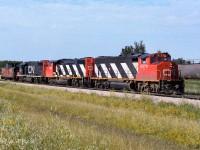 A cab hop headed due north here, destination will be Waterways to pickup 50 loads of sulphur and return to Edmonton. The 5533 in the black noodle paint was a rare visitor, this being my only time taking photos of it. To connect to my last post of the 1082 in 1985 on the abandoned Lac La Biche Sub. Behind the 5579, you can see ammonia tanks now stored on the old abandoned track. In 1985 they stored cars here twice, springtime with flats (the 1082) and covered hoppers in the fall, which returned from storage in October back to Edmonton (an older previous post of mine with the 1069). The ammonia tanks will return in the fall of 86 and I believe they never stored cars here again. I will not be much longer until the old 60lb rail was removed. My photo of the 1082 is approx. 2km west of this spot, down the track with the tanks on it. I added GPS as you can still see where the old tracks ran in the aerial photos. Time of this photo, 8:30 on the north end of the connecting track, shot with Kodak 100ASA film.