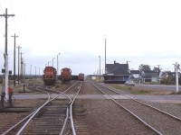 Coming onto PEI (by ferry) in 1981 I was rather surprised to see so much Island power down at the Borden yard. The station is on the left, and on the right in the yard is CN 1753 with 1751 behind, out of sight, and CN 1752 on the right. These MLW RSC-18 models would be retired by 1996 at the very latest; and according to the Trackside Guide, the 1751 ended up in Cuba!! Several buildings on the left had been razed since the last time I had photographed at this location, four years previous in 1977.
I would assume the station is long gone, as the area is totally redeveloped due to the new Confederation Bridge approach thru there. Someone mentioned to me the station was "down by the pier" but I am thinking that would be a replica. Not sure.