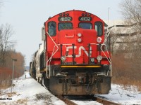 Over the past two decades, the Waterloo Spur has seen its fair share of change. From the arrival and departure of the fallen flag Waterloo-St. Jacobs Railway (WSJR) to now tourist hauler Waterloo Central Railway (WCR) as well as becoming an integral section of the ION light railway network. Also from being serviced by CN, then throughout the following years under the Goderich-Exeter Railway (GEXR) and then two years ago back to CN. 
<br>
Thanks to a reportedly faulty switch on the ION, CN L566 had timed-out overnight with CN 4102 with the crew making it as far as Randall Drive in north Waterloo. A daylight curfew prohibits CN movements on the ION portion of the spur, so in turn L566 couldn’t resume its trip back to Kitchener until 23:00 with a fresh crew. Thankfully, the seemingly endless winter overcast had parted briefly to illuminate CN 4102 as it idled away at the crossing as seen just after 13:00. Now much like decades prior, CN GP9RM’s are still operating on the spur despite all the changes that have occurred to the line. However, unlike the 1990’s it now takes an extreme circumstance to photograph one in daylight between Kitchener and Elmira. Let’s hope there will be more in 2021. 
