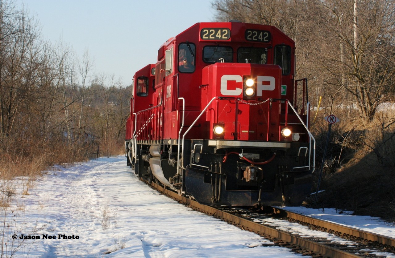 CP T99-23 passes Mile 4 on the Waterloo Subdivision in Preston, Ontario with 2242, 2281 and 4007. The job was returning with a short train from  the yard at Hagey in Cambridge to Wolverton yard on the Galt Subdivision. February 23, 2020.