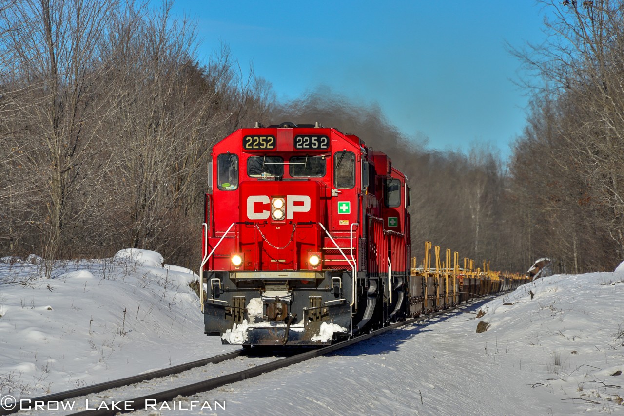 CP 9-119 breaks the silence as it passes by Anderson Rd just outside of Tichborne, Ontario with the Smiths Falls yard units leading a 76 empty car train.

Although I have never seen this happen in the past couple years I've been railfanning I heard its actually pretty common to have empty, stored cars returned to service after with the yard units after the manufacturing facilities change their tooling for the next models of cars. That's for the autoracks at the tail end of this train. As for the baretables up front I can only guess it's for a similar reason.

Despite it never being confirmed I believe the power returned trailing on 112 later that night/ early the next morning to power the next F55 servicing the Omya factory in Perth.