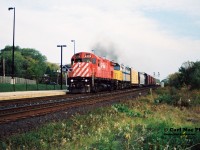 CP train 923 with 4239 and VIA Rail 6455 is heading westbound at Streetsville, Ontario on the Galt Subdivision. During 1994-1995 CP had leased several VIA Rail units to assist them through their severe motive power shortage until the new GE's that were on order started arriving. 
<br>
Also of note; according to Branchline Magazine, this train also lifted new Caltrans F59PHM-I's 2003 and 2002 from London that day. Both of these had recently been built at the GMDD facility and were enroute to California. 