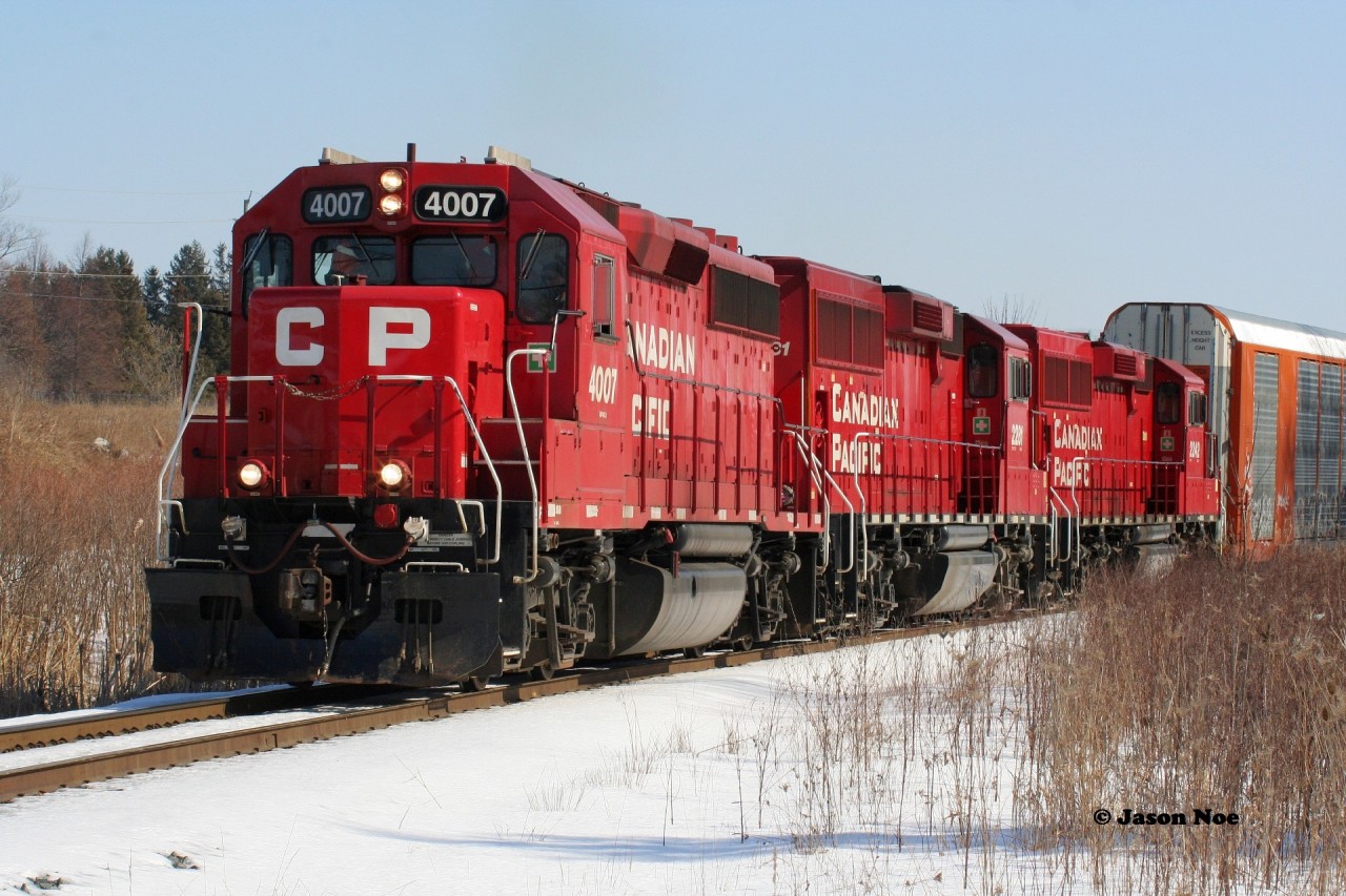 CP T72 with 4007, 2281 and 2242 is approaching Fountain Street and Hagey yard in Cambridge on the Waterloo Subdivision as it completes its trek from Wolverton with 18 cars for Toyota. CP GP40-3 4007 started out life as Milwaukee Road 2066 before becoming SOO Line 2066. February 22, 2020.