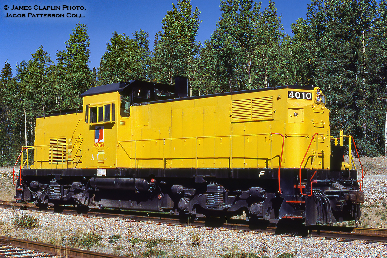An oddball on the Canadian locomotive scene is this ALCO C415, one of only 26 built between 1966-1968.  These unique locomotives were designed as a "combination road and yard switcher," with three cab options; low, medium (pictured), and high (for road use), depending on the operator's needs.  The 4010 is seen at the Aquitaine Ram River Gas Plant, and was one of two C415s two work there, the other being Aquitaine 4011.  Unlike most C415s which used the standard AAR trucks, these units, both of Spokane, Portland & Seattle Railroad heritage, were constructed with ALCO's high adhesion trucks.As SP&S's only C415s, both 4010 and 4011 spent much of their careers working alongside one another.  4010 was originally built as their #100, later becoming Burlington Northern 4010 in 1970.  Aquitaine 4011 began as SP&S 101, to BN 4011, and Aquitaine 4011.  Following retirement by BN in mid-1980 and the 1981 sale to Aquitaine, the units would arrive at the Ram River facility not long before this image was taken.  By 1982, the units were restenciled for the facility's new owner, Canterra Energy, operating with them until the company's 1989 purchase by Husky.  As of January 1, 2021 Husky is now owned by Cenovus.  Husky Energy would retire both locomotives in 1996 and they would return to the states operating for Ohio River Terminals in Huntington, West Virginia.  Little information can be found past this point, but it seems the units were worked hard with little maintenance, both retired in 2004 in need of new wheels and a new prime mover for 4010.  After being up for sale for a year, both units were scrapped onsite in July, 2005.A 1997 video of 4010/4011 working Ohio River Terminals can be found here.James Claflin Photo, Jacob Patterson Collection slide.