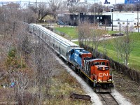 CN GMD-1u 1408 and GTW GP38-2 5849 are hard at work pulling a decently sized train from the CP interchange, with mixed freight and brand new Canpotex hoppers from National Steel Car.