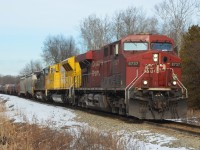 Shot 4 - 5 miles south of Campbellville. Hamilton bound #246. A surprisingly mild and sunny January Monday afternoon (2C). CP #8737, EMDX #7210 and CSX #489