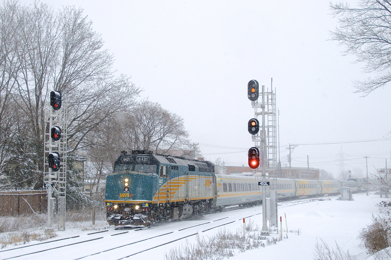 VIA 63 splits a set of signals with VIA 6421 up front and VIA 901 on the rear. At right CN X306 is lined on the south track.