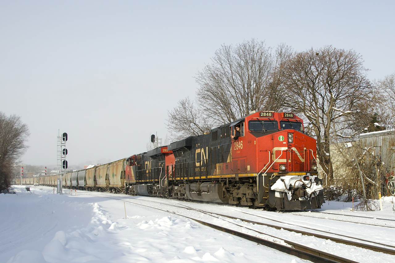 With the usual 205 loaded potash cars and a train weighing in at about 30,000 tons, CN B730 is passing MP 3 of CN's Montreal Sub with a new crew onboard to take it to the next crew change spot of Joffre Yard.
