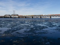 Normally into Montreal before sunrise since a schedule change at the end of last summer, CP 253 has been delayed by a broken rail further south, allowing it to enter Montreal in daylight. Here it crosses the icey St. Lawrence River with CP 8869, CP 2228, CP 9705 and 57 cars.