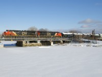 ES44AC's CN 2972 & CN 2944 lead CN 527 over the snow-covered Lachine Canal a few hours after a snowstorm ended.