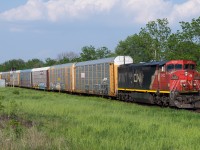 CN 2452 leads CN 271 through Ingersoll on a warm May evening.