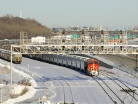 Empty grain train CN 875 is stopped at Turcot Ouest, about to get a new crew to take it to the next crew change spot at Belleville. 