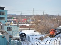 CN 7241 and booster 242 was along for the ride today coming back from Oakville. This spot would be great if it wasn't for the wire draping across in front of the factory, it is what it is.