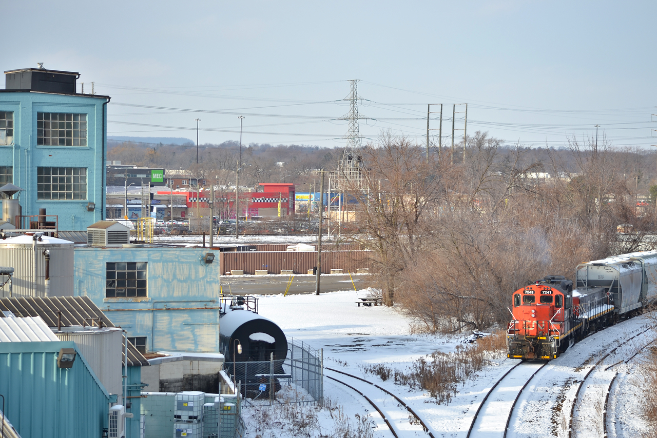 CN 7241 and booster 242 was along for the ride today coming back from Oakville. This spot would be great if it wasn't for the wire draping across in front of the factory, it is what it is.