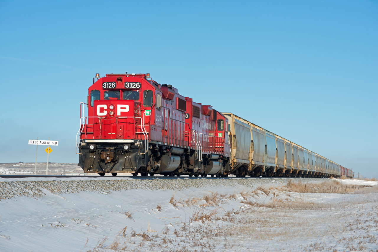 CP K36 shoves a cut of potash empties up the Kalium Spur toward the Mosaic mine past the Belle Plaine Sub junction switch.
