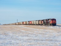 January 1st 2021 see's a daylight CN 556 on the Central Butte Subdivision. The entire 100 car train is visible, as is the elevator at Stony Beach five miles to the west. 