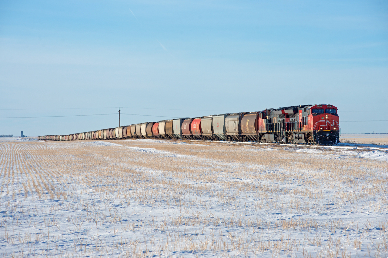 January 1st 2021 see's a daylight CN 556 on the Central Butte Subdivision. The entire 100 car train is visible, as is the elevator at Stony Beach five miles to the west.