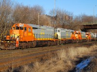 RLK 3873 pulls Wellsboro and Corning Railroad (WCOR) SD40-2s 307, 302, 301 and 309 out of Stuart Street yard to be lifted by CN.  They would be interchanged to NS in Buffalo, who would take them down the southern tier to Corning, NY and interchange to the WCOR.  The four SD40-2s arrived in Hamilton as QNSL and were crudely patched "WCOR"at Railcare before continuing on their trip to the states.  

The area of Pennsylvania that WCOR serves was experiencing a boom in oil fracking, and the railroad needed bigger power to haul the seemingly endless hoppers of fracking sand to be used in the fracking process.  WCOR went nuts relaying double track and building sidings to store the hopper cars waiting to be unloaded.  The railroad became so attractive it was snatched up by shortline holding company Genesee and Wyoming.  Soon after the G&W purchase oil prices dropped, fracking became less profitable and most if not all operations ceased.  That resulted in a huge drop in business for the WCOR, so much so that three of the four SD40-2s were reassigned to the Buffalo and Pittsburgh.  WCOR 307 and 309 still operate on the B&P.  I'm not sure about the status of 301 and 302; I know at least one of them was returned to the lessor.  

Regardless, the SD40-2s looked pretty snazzy while it lasted.  The WCOR even had this photo on their website for a while and it got me a free ride on the Tioga Central, the tourist train that operates on the WCOR between Wellsboro Junction and Hammond Lake.  Proof that sometimes you can get unexpected benefits from your photos!     