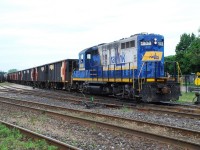 This is entertaining; continuing to play off each others photos.  Following up on James Knott's photo of CP ballast cars in CP's Fisher Yard, here's a Southern Ontario Railway ballast train consisting entirely of CP ballast cars.  The train had come up from Hamilton, where I just happened upon them when they were pulling in to the yard in Brantford to run around their train.  Now pointed in the right direction, the SOR ballast train departs the yard headed for the Hagersville Sub.  Early on, SOR got their ballast from CN.  This was the only time I saw CP ballast cars on SOR.  Later they would get ballast in a private company's hoppers, I don't recall the reporting mark, but they were plain maroon cars.  Near the end of SOR operating on the Hagersville Sub. a contractor trucked in several ancient ex. Amtrak ballast cars that were loaded in Hagersville.  I never got a photo of those cars or the ballast train; I wish I had!   