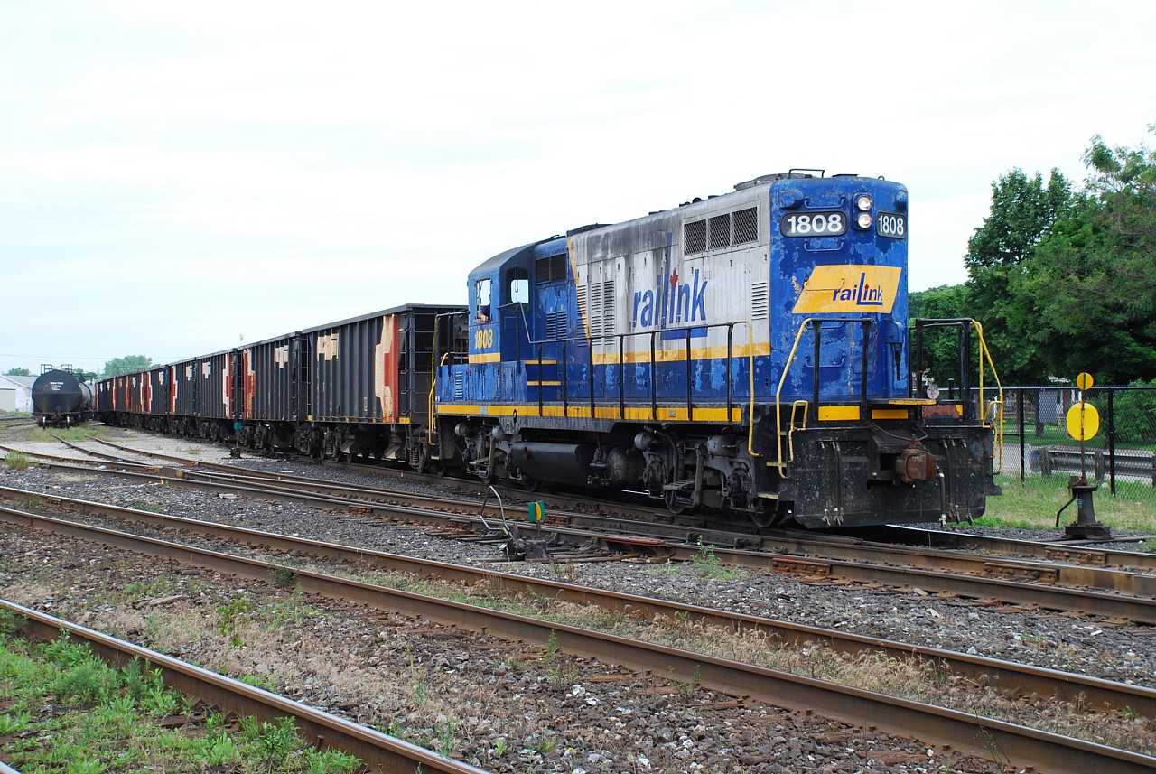 This is entertaining; continuing to play off each others photos.  Following up on James Knott's photo of CP ballast cars in CP's Fisher Yard, here's a Southern Ontario Railway ballast train consisting entirely of CP ballast cars.  The train had come up from Hamilton, where I just happened upon them when they were pulling in to the yard in Brantford to run around their train.  Now pointed in the right direction, the SOR ballast train departs the yard headed for the Hagersville Sub.  Early on, SOR got their ballast from CN.  This was the only time I saw CP ballast cars on SOR.  Later they would get ballast in a private company's hoppers, I don't recall the reporting mark, but they were plain maroon cars.  Near the end of SOR operating on the Hagersville Sub. a contractor trucked in several ancient ex. Amtrak ballast cars that were loaded in Hagersville.  I never got a photo of those cars or the ballast train; I wish I had!