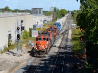 After combining the 4028/4116 with the 4725 and GMTX 2163, 568 slowly pulls its tonnage out of Kitchener Yard westbound for Stratford in the afternoon summer light. They were switching the yard with the GP38 pair until 540 with the GP9Rm’s arrived from Guelph to combine both sets together for the relatively up hill run to Stratford.