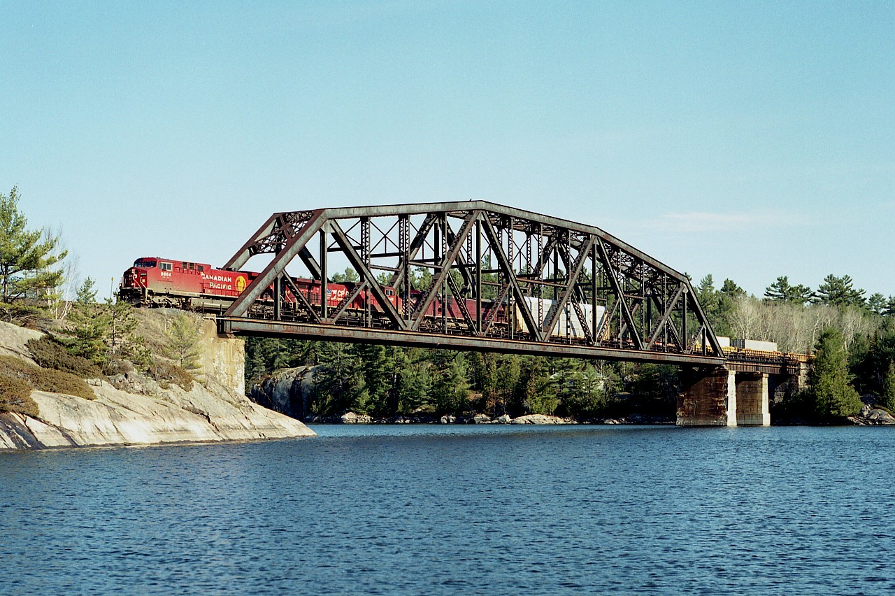 Not exactly what one would call an "exciting" catch, but the scenery is nice.  This is northbound CP 9664, 9546 and CEFX 134 running over the magnificent French River bridge on an equally magnificent spring morning.