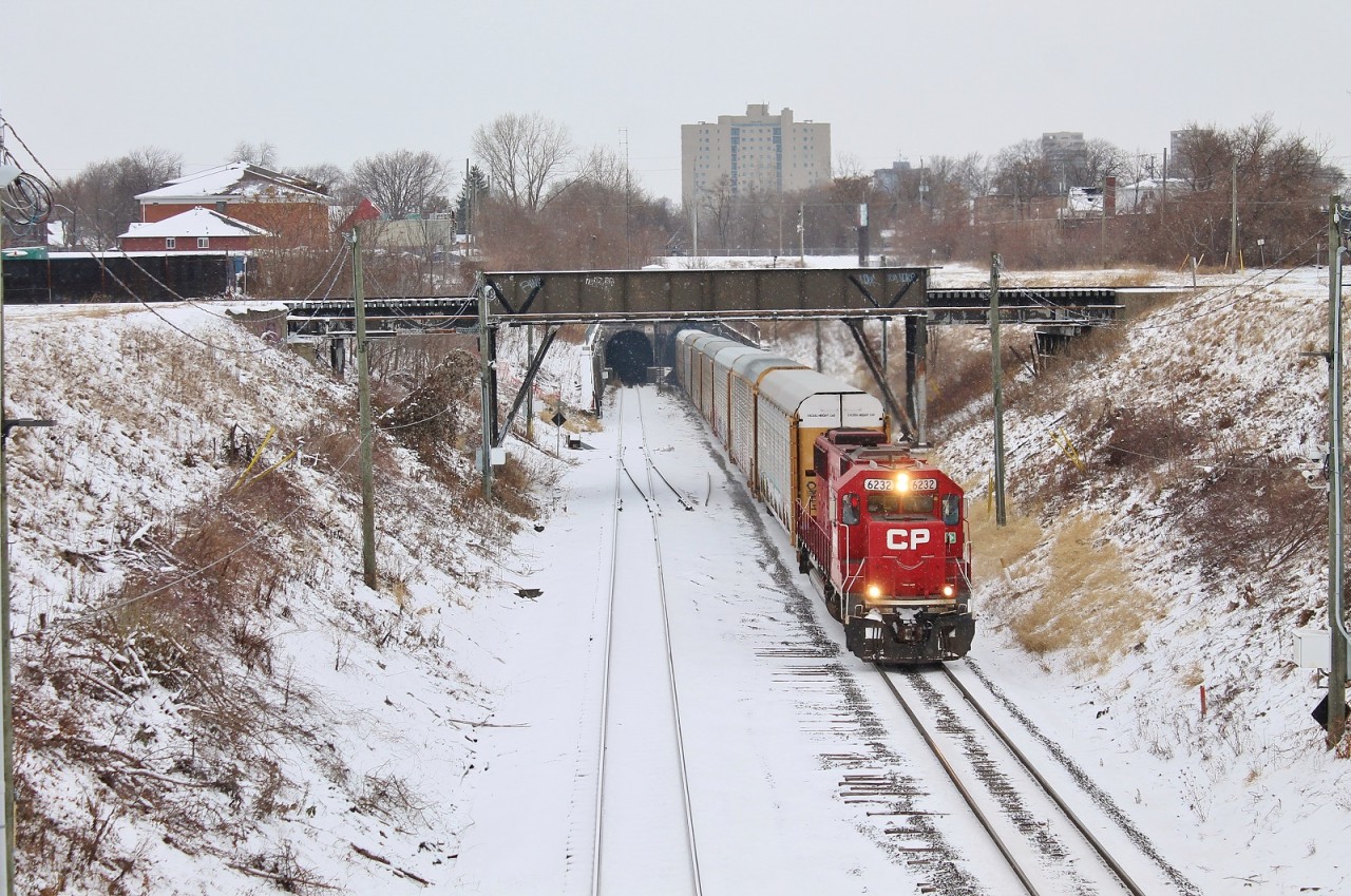 A one unit wonder 2-240 exits the Detroit River Rail Tunnel in Windsor in a light snow. They were notch 8 and barely breaking 20mph.