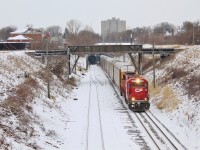 A one unit wonder 2-240 exits the Detroit River Rail Tunnel in Windsor in a light snow. They were notch 8 and barely breaking 20mph. 