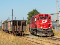 I had no real intentions of posting this any time soon, but following on mention of these ballast cars in Rob's <a href="http://www.railpictures.ca/?attachment_id=44099" target="_blank">2003 shot of Fisher Yard</a>, I will offer this view. They are sitting on what is the main of the Belt Line, and have been shoved a little further west now. As I mentioned in Rob's shot, I have seen these cars come and go, and asked one of the Kinnear guys who told me they have used them to add weight to the head end of 255's lift before, but don't really need to anymore because 255's lift consistently has AIM loads on it now. <br><br>For those who like the details- this was a Saturday during the time in the Fall when the Welland day crew (TE11) did their Saturdays in Hamilton. They're on the Stelco lead with a pull of empty two-bays from Bell & MacKenzie.